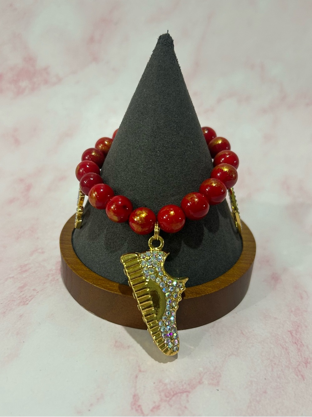 Gold and Red Beaded Bracelet with Crystal Piano Charm